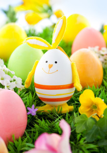 colorful Easter Eggs and rabbit on the grass